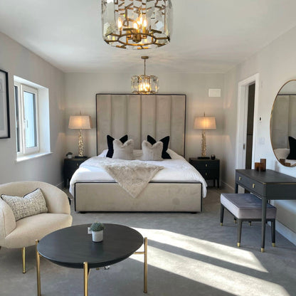 Custom Belle bed & frame with a tall, paneled upholstered headboard in a neutral, luxurious bedroom.